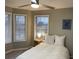 Bedroom with neutral walls and flooring and bright windows at 7245 W Strickland St, Douglasville, GA 30134