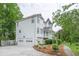 Charming home featuring a two-car garage, beautiful landscaping and a turret at 7245 W Strickland St, Douglasville, GA 30134