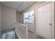 Laundry room access and stairway in hallway at 7245 W Strickland St, Douglasville, GA 30134