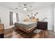 Bedroom boasts wood floors, floating bed frame, and a unique decor at 1490 Ashbrook Dr, Lawrenceville, GA 30043