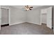 Bedroom with carpeted floors, a ceiling fan, and two closets at 1774 Northwick Pl, Lithonia, GA 30058