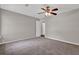 Bedroom with carpet, neutral walls, and view into ensuite bathroom at 1774 Northwick Pl, Lithonia, GA 30058