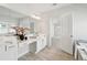 Bright bathroom featuring double vanity, marble floors, and ample counter space at 2865 Ferncliff St, Cumming, GA 30028