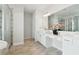 Bright bathroom with double vanity, large mirror, and glass-enclosed shower at 2865 Ferncliff St, Cumming, GA 30028