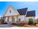 Charming exterior featuring brick accents, wooden beams, and a cozy front porch at 2865 Ferncliff St, Cumming, GA 30028