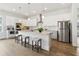 Gourmet kitchen featuring a large island, stainless steel appliances, and stylish white cabinetry at 2865 Ferncliff St, Cumming, GA 30028