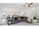 Open-concept living room seamlessly connects to the kitchen and dining area, perfect for entertaining at 2865 Ferncliff St, Cumming, GA 30028