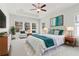Spacious main bedroom suite with tray ceiling, sitting area, and bright windows at 2865 Ferncliff St, Cumming, GA 30028