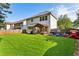 Large backyard with green grass, a patio with gazebo, play equipment and wooden fence at 301 Downing Creek Trl, Canton, GA 30114