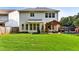 Large backyard with a covered patio area, perfect for outdoor gatherings and relaxation at 301 Downing Creek Trl, Canton, GA 30114