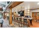 Stylish bar area with ample seating, wood accents, and well-stocked shelves for a relaxing and social atmosphere at 301 Downing Creek Trl, Canton, GA 30114