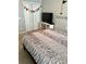 View of bedroom with white closet doors, a TV and a queen sized bed at 301 Downing Creek Trl, Canton, GA 30114