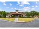 Charming clubhouse with stone accents, manicured landscaping, and inviting entrance for community gatherings and events at 301 Downing Creek Trl, Canton, GA 30114