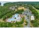 Overhead image highlights the resort-style community pool and recreational amenities, surrounded by verdant greenery at 301 Downing Creek Trl, Canton, GA 30114
