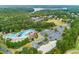 Aerial view of the resort-style community pool with a lake view, mature trees and lush landscaping at 301 Downing Creek Trl, Canton, GA 30114