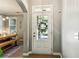 Bright entryway with a view into the dining room, showcasing natural light and open design at 301 Downing Creek Trl, Canton, GA 30114