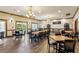 Elegant event space with chandeliers, wood floors, large windows, and tables with seating for gatherings and celebrations at 301 Downing Creek Trl, Canton, GA 30114