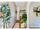 Inviting entryway with hardwood floors, gray walls, decorative plant, and stylish accents at 301 Downing Creek Trl, Canton, GA 30114