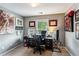 Well-lit home office with neutral walls and framed artwork, offering a comfortable workspace at 301 Downing Creek Trl, Canton, GA 30114