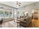 Spacious living room featuring hardwood floors, many windows and natural light at 301 Downing Creek Trl, Canton, GA 30114