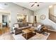 Spacious living room featuring hardwood floors, a large sectional sofa and view to kitchen at 301 Downing Creek Trl, Canton, GA 30114