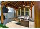 Covered patio with plush seating around a fire pit, perfect for outdoor relaxation and entertaining at 301 Downing Creek Trl, Canton, GA 30114
