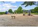 Large playground area with various play structures and swings, perfect for children to enjoy outdoor recreation at 301 Downing Creek Trl, Canton, GA 30114