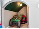 Cozy alcove in a bedroom, featuring a novelty monster truck and tent for imaginative play at 301 Downing Creek Trl, Canton, GA 30114