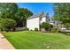 Expansive lawn surrounds this well-maintained house, accentuated by mature trees and landscaping at 301 Downing Creek Trl, Canton, GA 30114