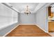 Elegant dining room with a chandelier, hardwood flooring, and natural light at 4000 Crossings Way, Stone Mountain, GA 30083