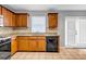 Well-lit kitchen boasts granite countertops, tile floors, and stainless steel oven and dishwasher at 4000 Crossings Way, Stone Mountain, GA 30083