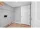 This laundry room features tile floors, a door, and shelving at 4000 Crossings Way, Stone Mountain, GA 30083