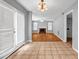 Bright living room featuring tile floors and doors leading to the fenced in yard at 4000 Crossings Way, Stone Mountain, GA 30083