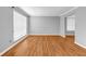 Bright and open living area with large window and hardwood flooring at 4000 Crossings Way, Stone Mountain, GA 30083