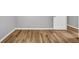 The room showcases hardwood floors, white baseboards, and a white door at 4000 Crossings Way, Stone Mountain, GA 30083
