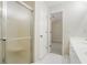 Bathroom featuring tiled floors, a large shower and an open door to the bedroom at 4124 Berwick Farm Dr, Duluth, GA 30096