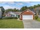 Charming single-story home with well-manicured lawn, brick accents, and a two-car garage at 4124 Berwick Farm Dr, Duluth, GA 30096