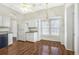 Eat-in kitchen with granite countertops, bright windows, and hardwood floors at 4124 Berwick Farm Dr, Duluth, GA 30096