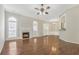 Bright and airy living room features a fireplace, arched windows, and beautiful hardwood floors at 4124 Berwick Farm Dr, Duluth, GA 30096