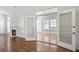 Bright living room featuring an opened doorway to another living space with plenty of natural light at 4124 Berwick Farm Dr, Duluth, GA 30096