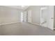 Spacious main bedroom with plush carpet, ensuite bathroom, and ample natural light at 4124 Berwick Farm Dr, Duluth, GA 30096