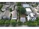 An aerial view shows several traditional homes, featuring neatly landscaped lawns and mature trees in a suburban setting at 647 East Ne Ave, Atlanta, GA 30312