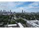 Aerial view features a cityscape, showing a vibrant skyline and lush green trees at 647 East Ne Ave, Atlanta, GA 30312