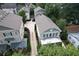 Aerial view shows traditional home with well-manicured lawns and driveway at 647 East Ne Ave, Atlanta, GA 30312