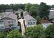Aerial view of traditional homes with well-manicured lawns and driveways in a lush, green neighborhood at 647 East Ne Ave, Atlanta, GA 30312
