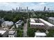 Aerial view featuring a neighborhood of modern homes and condos with the downtown skyline in the background at 647 East Ne Ave, Atlanta, GA 30312