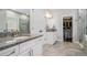 Granite vanity with dual sinks, walk-in closet, and glass shower in this modern bathroom at 647 East Ne Ave, Atlanta, GA 30312