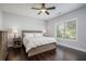 Cozy bedroom with ceiling fan, hardwood floors, and bright window at 647 East Ne Ave, Atlanta, GA 30312