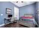 Cozy bedroom with desk, hardwood floors, and blue walls at 647 East Ne Ave, Atlanta, GA 30312