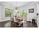 Dining room with bright window light, hardwood floors, and neutral color scheme at 647 East Ne Ave, Atlanta, GA 30312